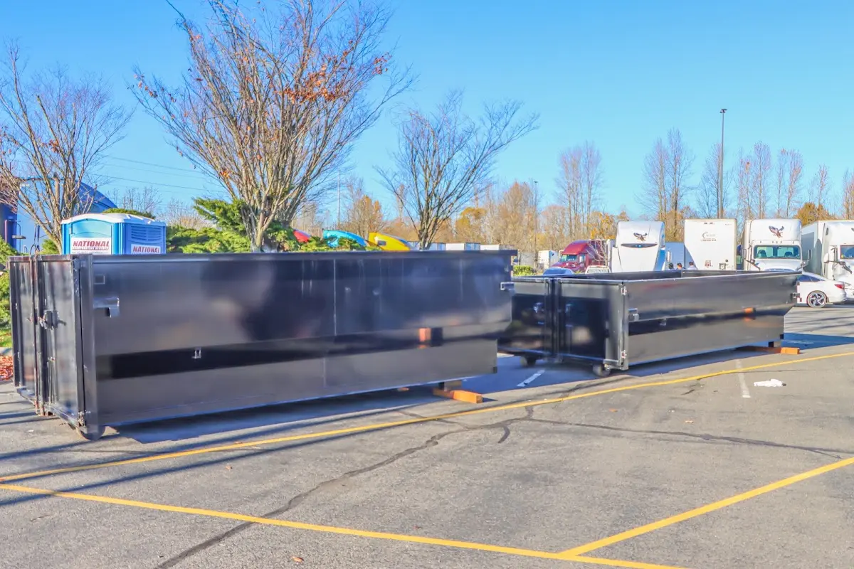 Professional dumpster rental service with roll-off container on residential driveway in Craig